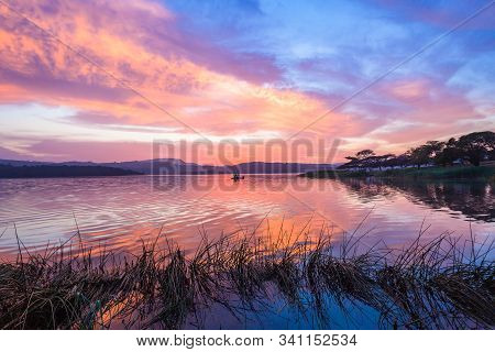 Dawn Sky Clouds Color Reflections Morning Fishermen Boat Dam Waters Holiday Landscape.