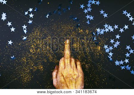 Hand Shows Aggressive Gesture With The Middle Finger. Fuck You Christmas And New Year Concept. Minim