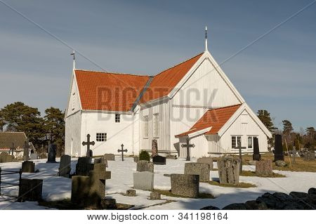 Tromoy Church At Hove, Tromoy In Arendal, Norway. White Church, Blue Sky, Sunny Day.
