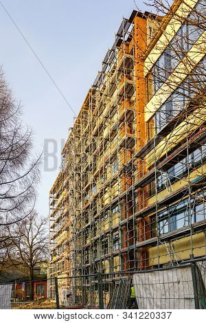 Scaffolding Arround The House To Install Thermal Insulation Of The Apartment Building Facade