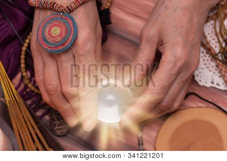 Woman Fortune Teller Holds A Ball Of Fate In Her Hands, A Magic Ball Of Predictions. The Concept Of 
