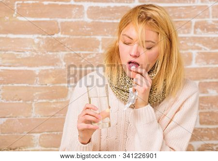 Woman Tousled Hair Scarf Hold Glass Water And Tablets Blister. Girl Suffer Fever And Take Medicine. 