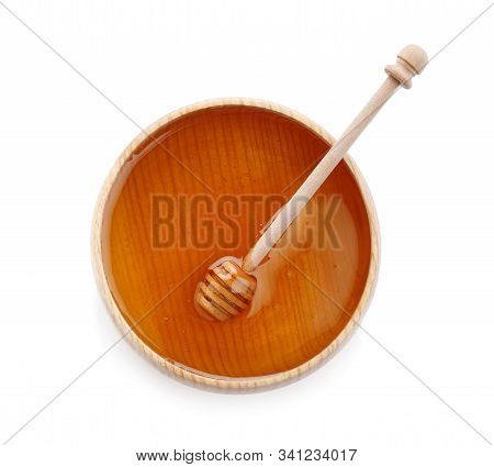 Bowl Of Organic Honey And Dipper Isolated On White, Top View