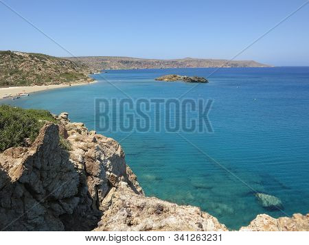 Beautiful View Of The Stone Coast Against The Blue Sea