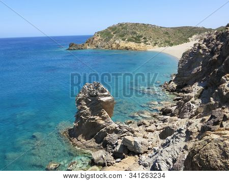 Beautiful View Of The Stone Coast Against The Blue Sea