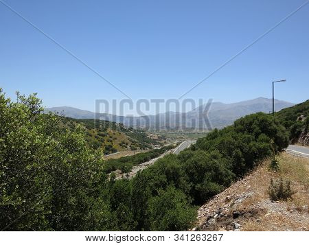 Beautiful Panorama Of Stone Mountains, Trees And Blue Sky
