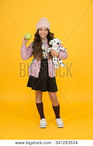 Schooltime Concept. Back To School. Happy Small Girl Hold Toy Dog. Winter Holiday Vacation. Childhoo