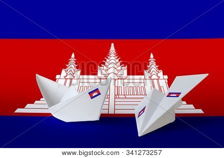 Cambodia Flag Depicted On Paper Origami Airplane And Boat. Handmade Arts Concept