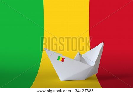 Mali Flag Depicted On Paper Origami Ship Closeup. Handmade Arts Concept