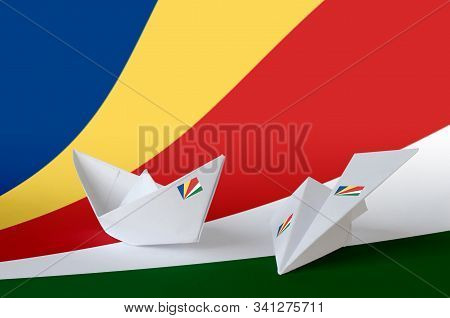 Seychelles Flag Depicted On Paper Origami Airplane And Boat. Handmade Arts Concept