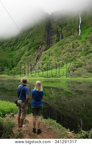 Young couple enjoying the landscape of Pozo da Alagoinha, also known as Pozo Ribeira do Ferreiro, Azores, Portugal, Europe
