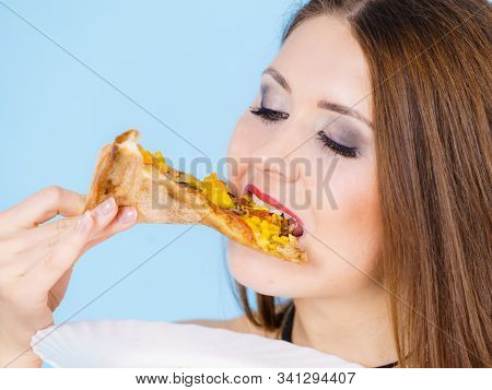 Young Woman Eating Hot Fresh Pizza Slice, On Blue. Delicious Fast Food Meal. People, Italian Cuisine