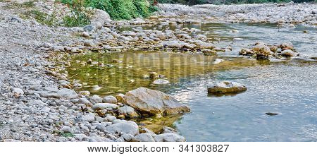 Wide Landscape Of Rocky Stream Mollarino Tributary Of The Melfa River In Late Summer Amid The Italia
