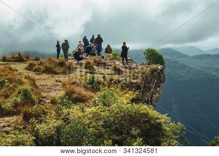 Cambara Do Sul, Brazil - July 18, 2019. People On The Edge Of Steep Rocky Cliff At Fortaleza Canyon 