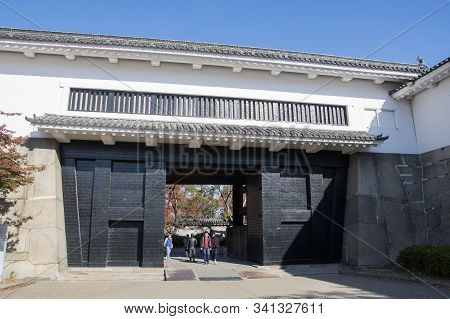 Osaka, Japan- 01 Dec, 2019: The Ornate Black And White Otemon Entrance Gate Of Osaka Castle.
