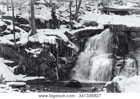 A Black And White Blurred Waterfalls Flowing Down Through Enders State Forest In Granby Connecticut 