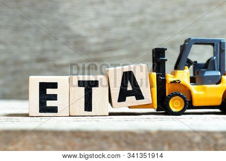 Toy Forklift Hold Letter Block A To Complete Word Eta (abbreviation Of Estimated Time Of Arrival) On