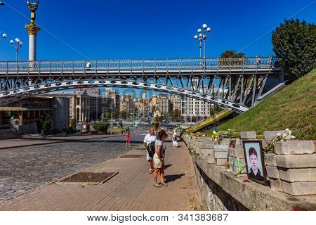 Kiev , Ukraine - August 30, 2019 : people in front of the Maidan square memorial honoring deads of the 2014 revolution Landmark of Kiev Ukraine Europe