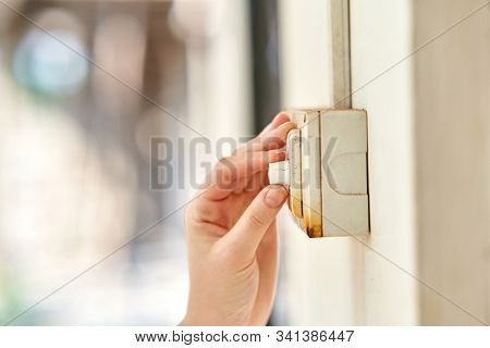 The Girl Controls The Power Of The Fan. The Girl Turns The Wall Switch.