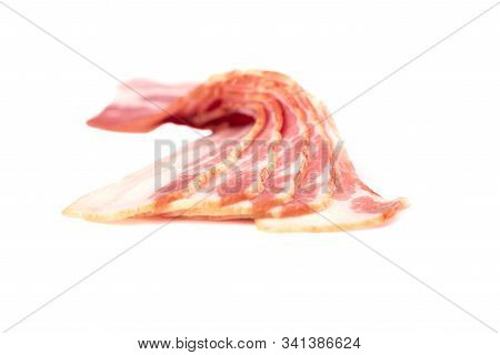 Selective Focus. Rashers Of Bacon Isolated On White Background.