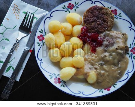 Potatoes With Meat, Sauce And Lingonberry Jam. Swedish Cuisine Pannbiff.