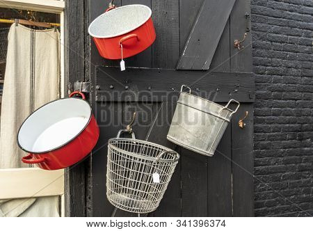 Vintage Kitchen Enamelware On The Black Background In Showcase