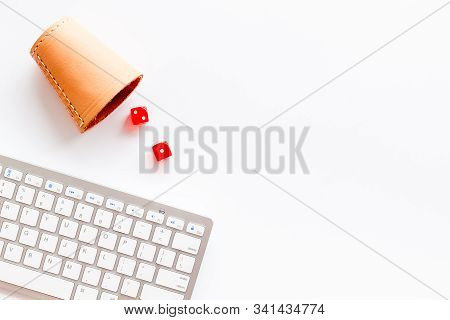 Hazard Gemes Online Concept. Dices Near Keyboard On White Background Top-down Copy Space