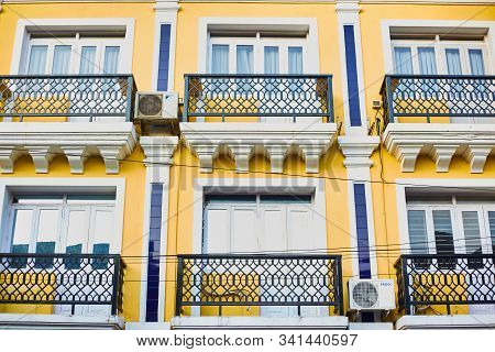 Panaji, Goa, India - December 15, 2019: Yellow House. The Facade Of A Yellow House With Balconies. S