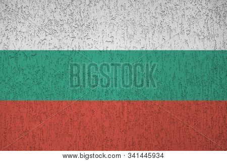Bulgaria Flag Depicted In Bright Paint Colors On Old Relief Plastering Wall. Textured Banner On Roug
