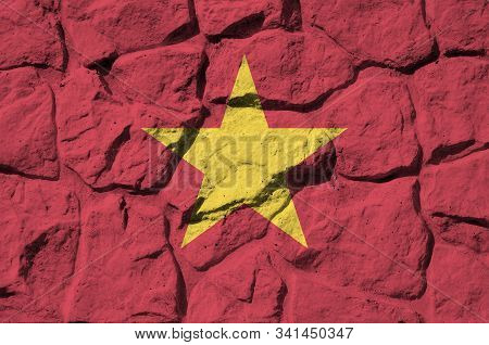 Vietnam Flag Depicted In Paint Colors On Old Stone Wall Closeup. Textured Banner On Rock Wall Backgr