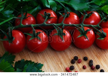 Fresh Vegetables On The Table. Food Background. Close Up. Cherry Tomatoes, A Bunch Of Parsley, Chopp