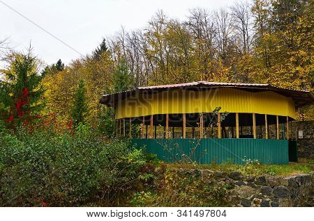 A Large Altan Made Of Multicolored Corrugated Sheet In Autumn Park