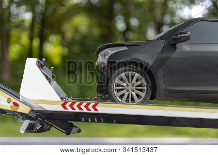 Accident Car Slide On Truck For Move. Black Car Have Damage By Accident On Road Take With Slide Truc