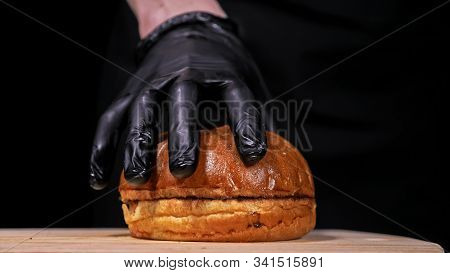 Craft Burger Is Cooking On Black Background. Consist: Sauce, Lettuce, Tomato, Red Onion, Pickle, Che