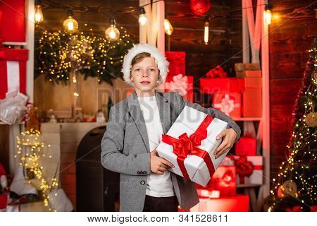 Teen Boy Help Santa With Presents. Visit Santaland This Holiday. Winter Wonderland In North Pole. Sm