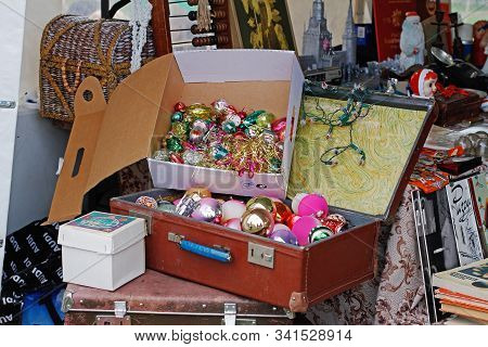 Pushkino, Moscow Region, Russia - July 13, 2019: Christmas Toys In A Suitcase And Paper Box At The F