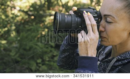 Traveler Photographing Scenic View In Forest. One Caucasian Woman Shooting Close Up Look. Girl Take 