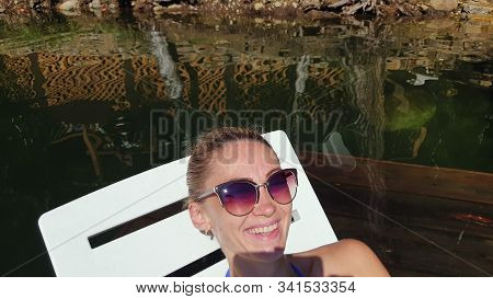 Woman Shooting Self Portrait. Take Photo And Video On Smartphone. Girl Rest, Relax, Walk In Sunglass