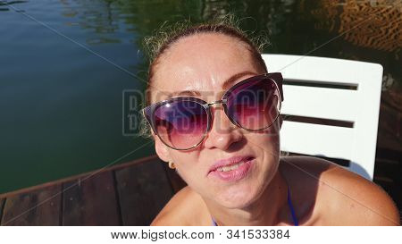 Woman Shooting Self Portrait. Take Photo And Video On Smartphone. Girl Rest, Relax, Walk In Sunglass