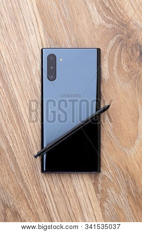 Rostov-on-don, Russia - December 2019. Samsung Galaxy Note 10 On A Wooden Table. Smartphone And Styl