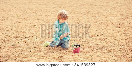 Happy Child Gardener. Botanic Worker. Spring Season. Ecology Life. Eco Farm. Human And Nature. Earth