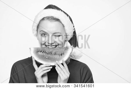 Christmas Girl Eat Watermelon. Woman Santa Hat Hold Slice Watermelon. Prolong Summer. Travel Christm