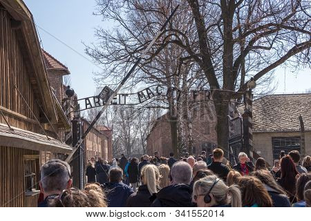 Oswiecim, Poland - April 7, 2019: People In Front Of The Entrance Of The Auschwitz Nazi Concentratio