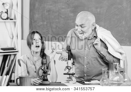 Little Girl With Man Tutor Study Science. Teacher Help Schoolgirl. Back To School. School Lesson. Ex