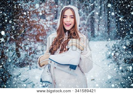 Girl Playing With Snow In Park. Women On Mountain. Beautiful Girl In The Winter Forest In White Down