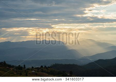 Sunlight Ray Shining On Beautiful Rice Terraces During Sunset In Pa Bong Piang Village In Chiangmai,