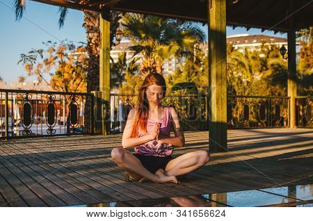 Beautiful Woman Practicing Yoga Outdoor. Namste, Meditating.
