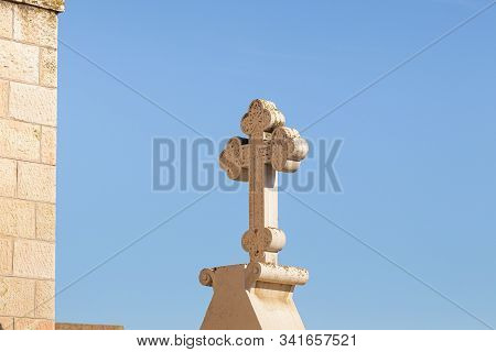 Jerusalem, Israel, December 28, 2018 : A Large Stone Cross Carved From Stone On The St. Nicholas Chu