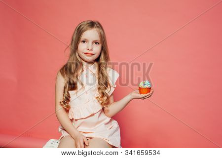Beautiful Little Girl Blonde With Cake And Candy Portrait Of Food