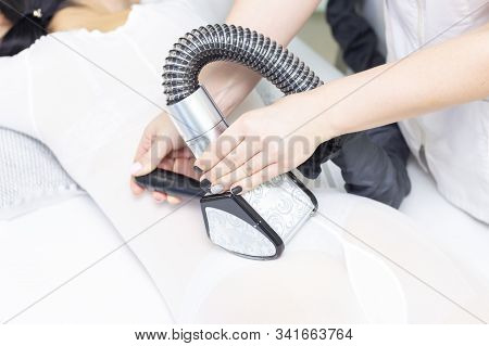 Lpg Girl Body Massage In Spa. The Girl Is Given A Hardware Massage, She Is Wearing A Special Jumpsui